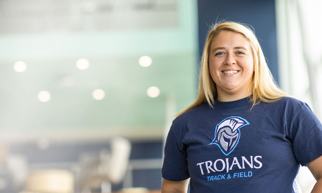 a female student in a Dakota State t-shirt